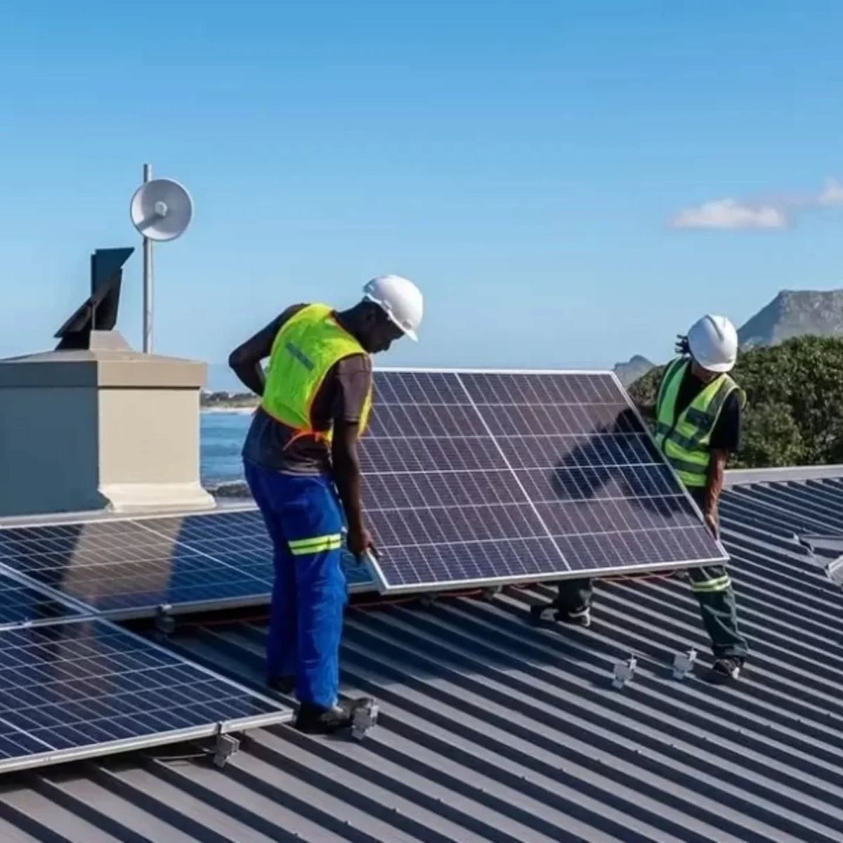 Professional solar installation team working on residential system in Nigeria